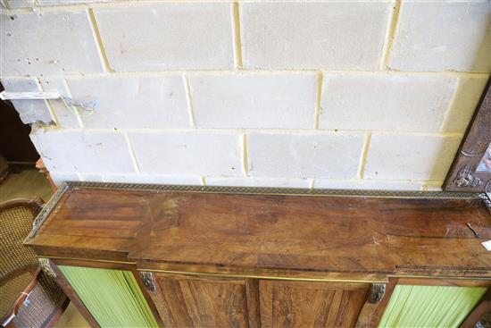 A Regency brass inset rosewood breakfront dwarf bookcase, with pierced brass three quarter gallery, two panelled and two pleated doors,